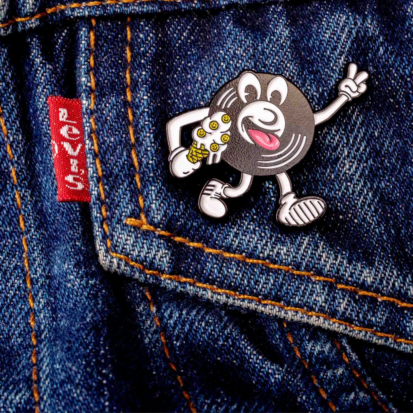 Acid House Pin Badge, Hot Wax Vinyl Design on a denim jacket