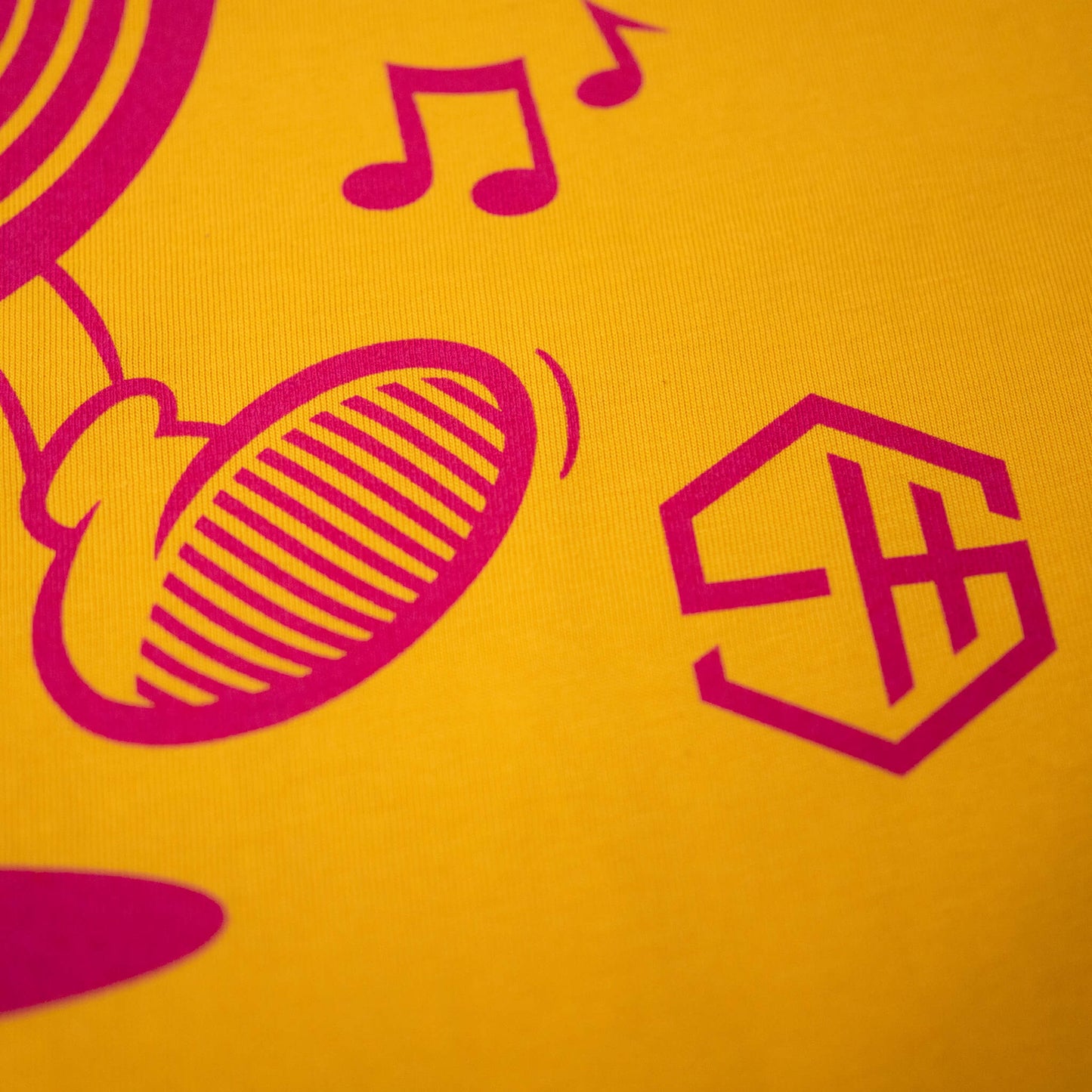 Character design screen printed yellow t-shirt detail