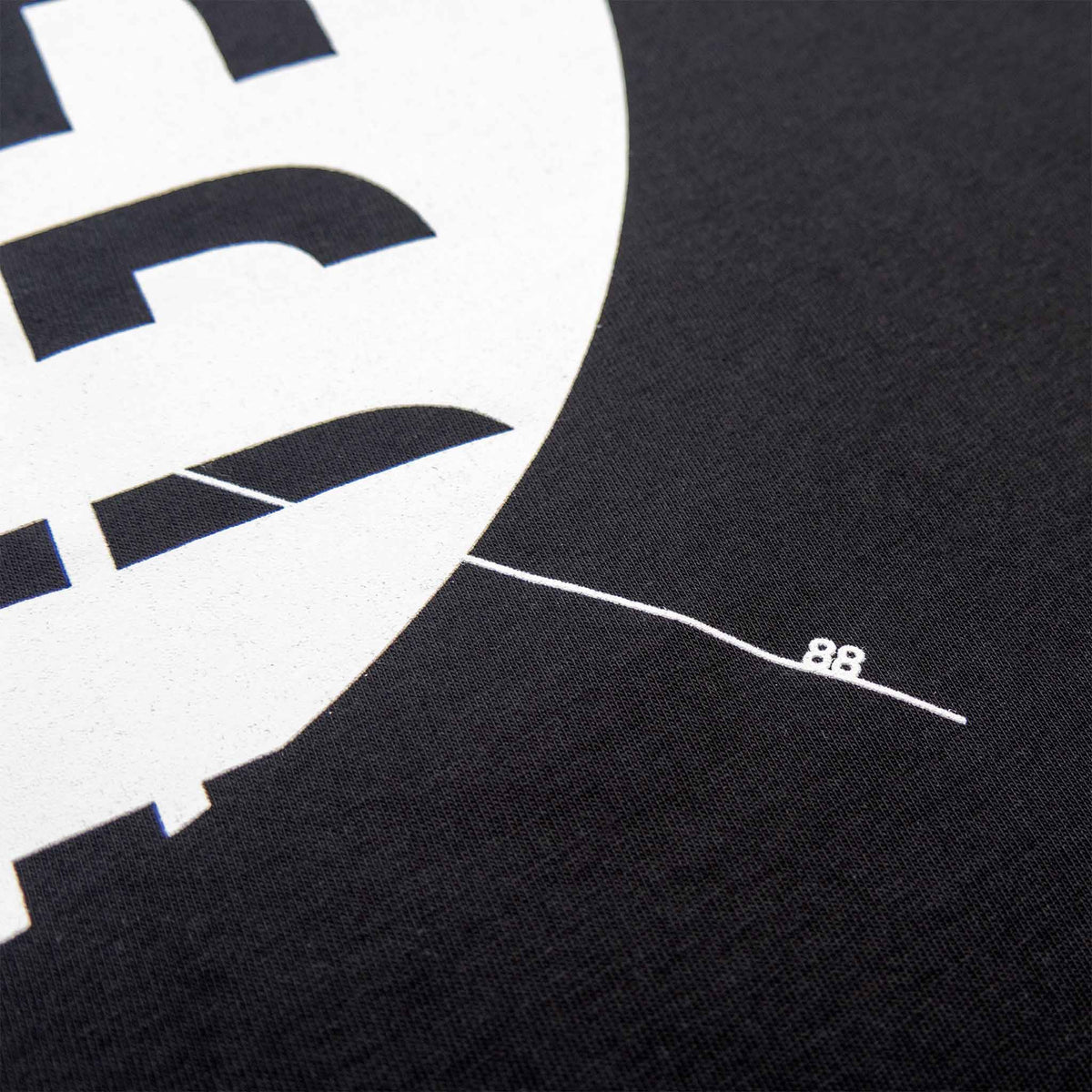 Black acid house t-shirt with white ink 1988 design detail