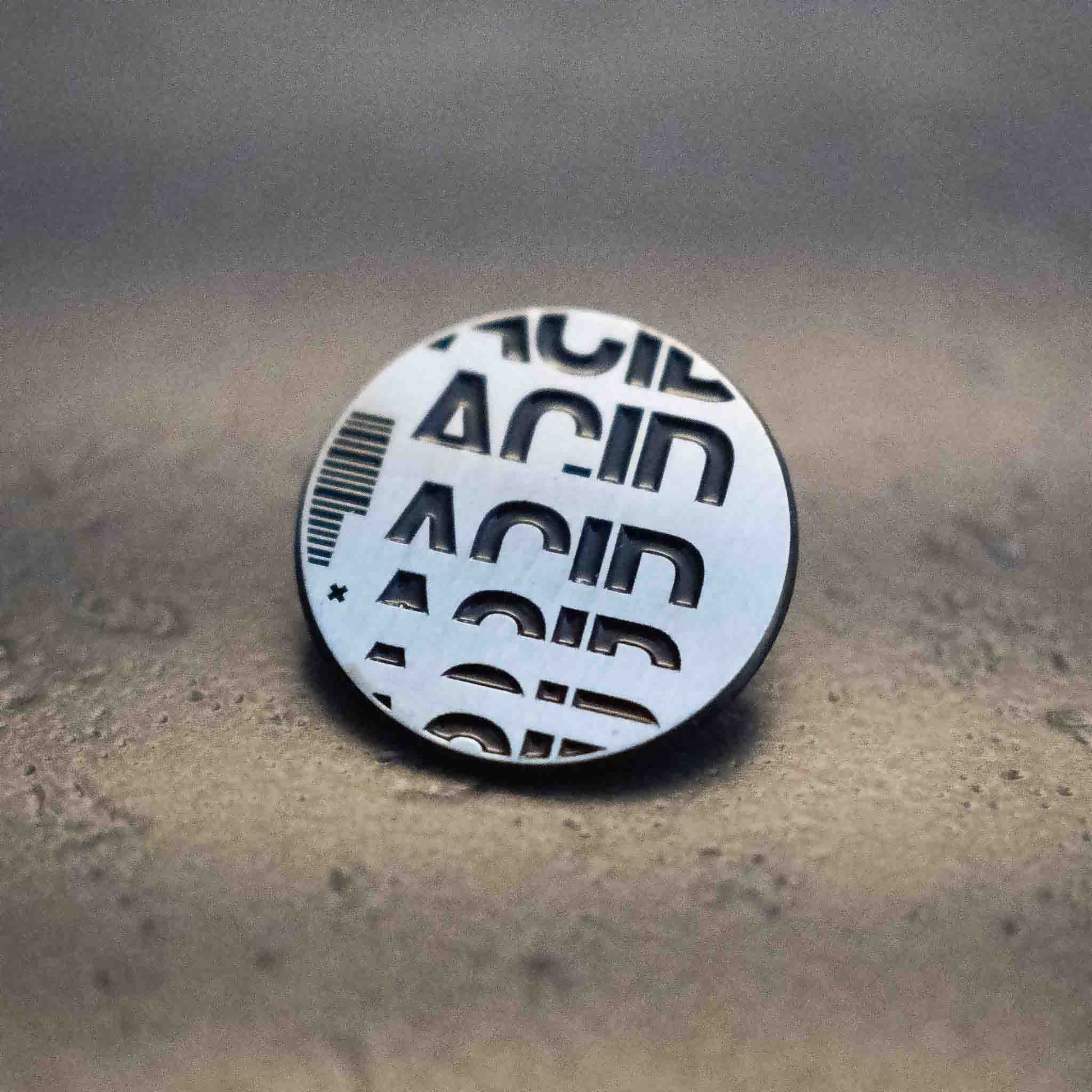 Antique silver with black enamel acid house pin badge