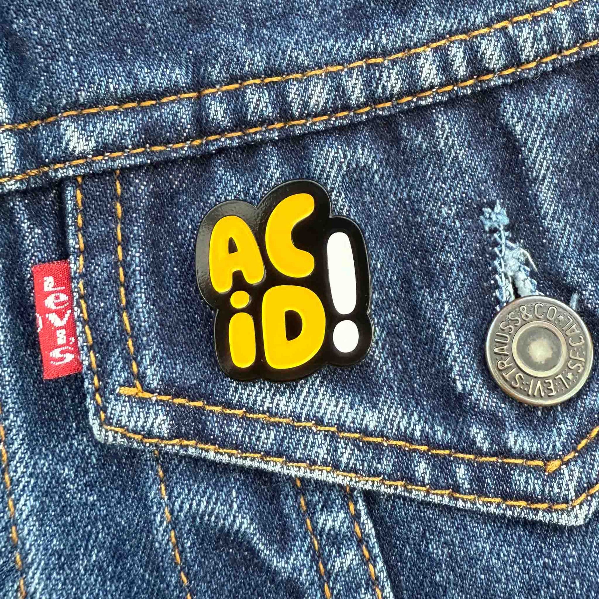 Yellow Acid House Pin Badge on pocket