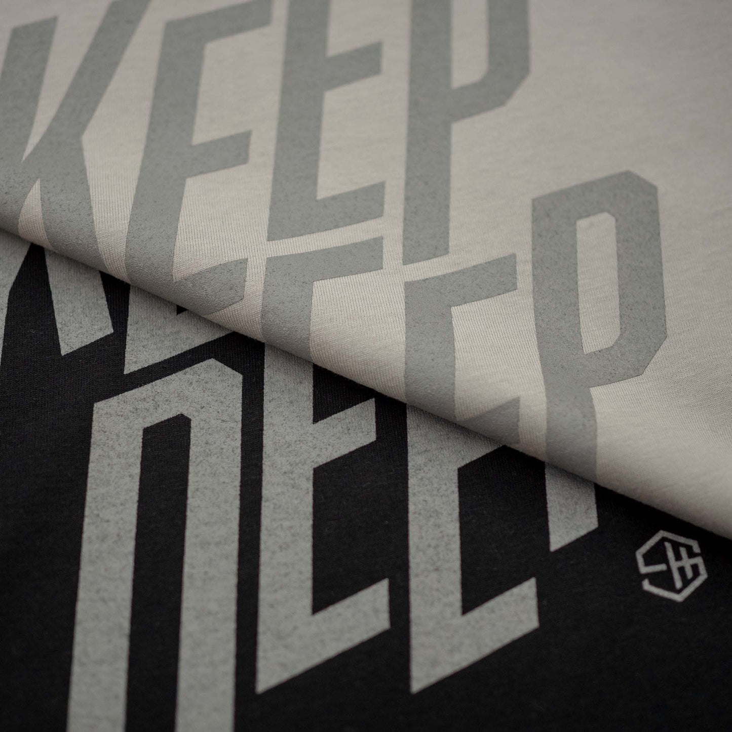 Keep Deep Black and Opal Grey T-shirt details with Silver Grey type graphics