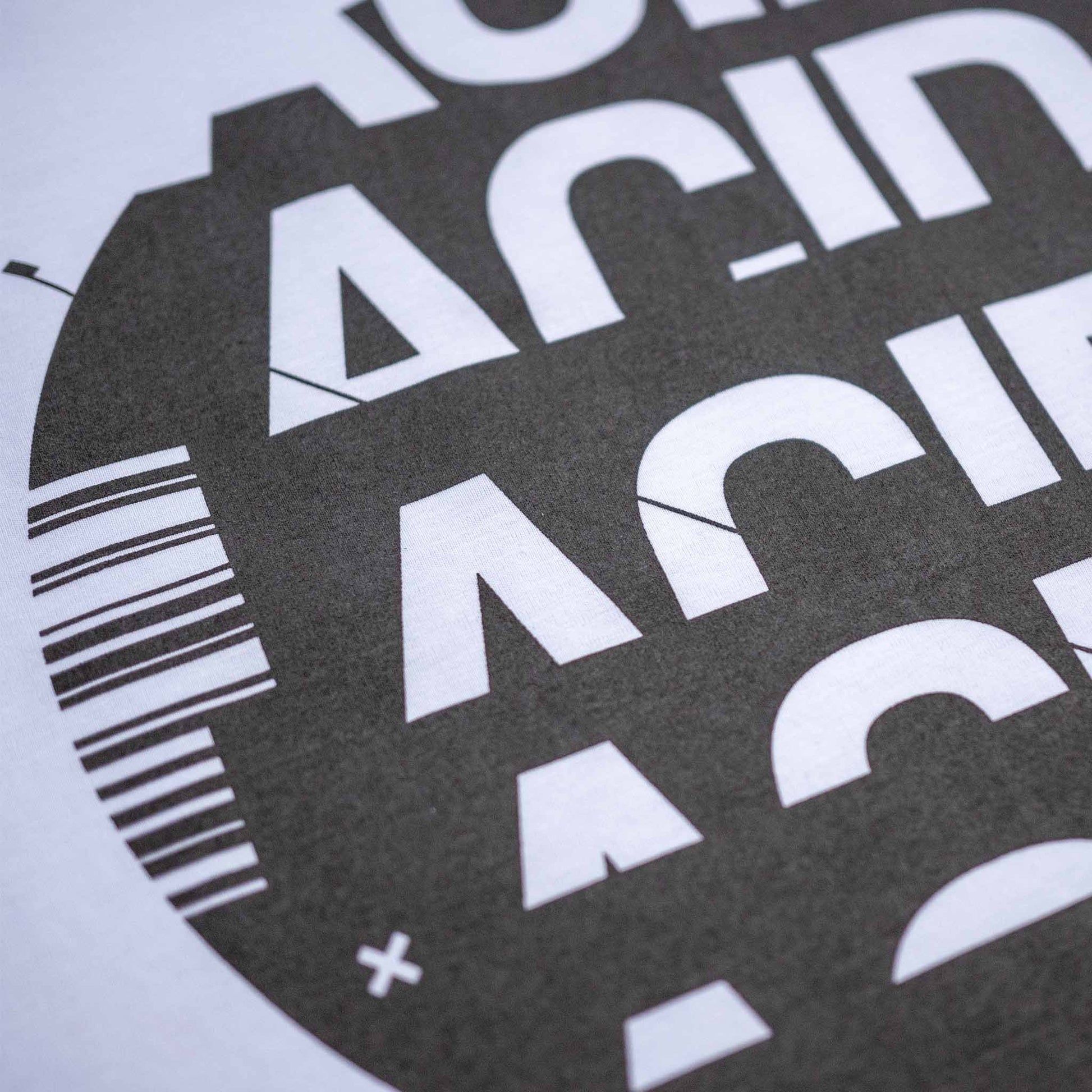 Acid typography screen-printed in graphite grey