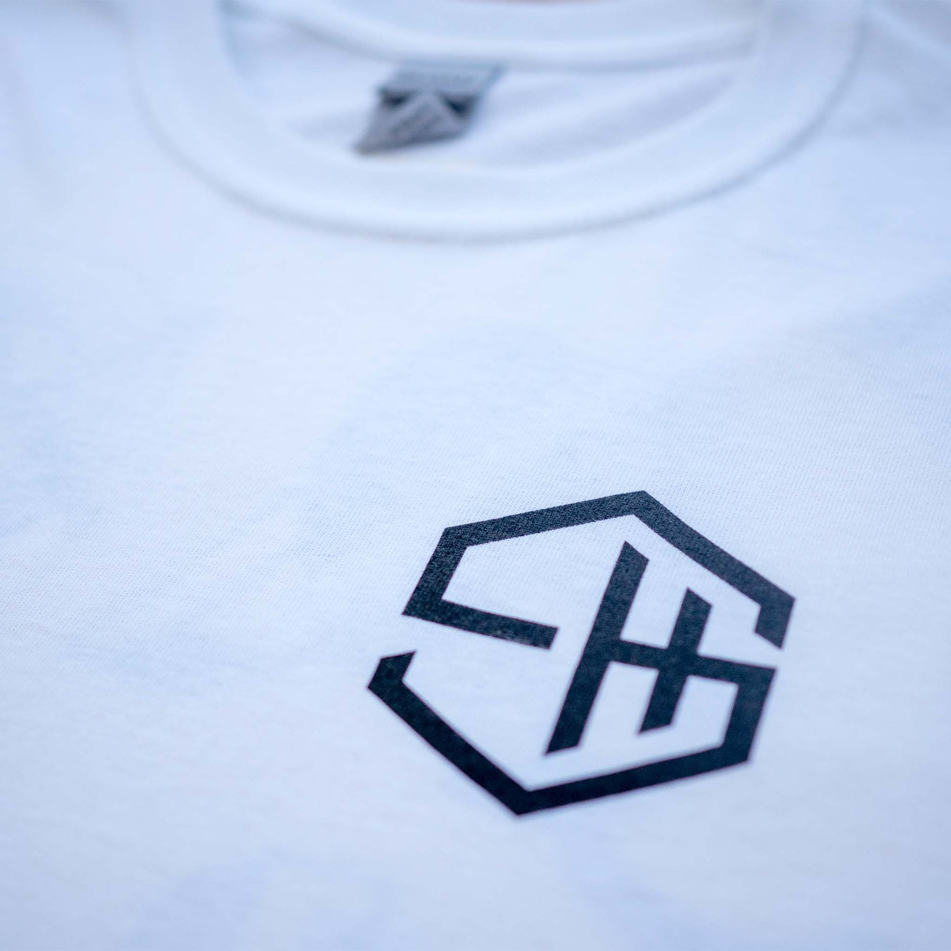 Subhustle logo chest print detail on white acid house music t-shirt design