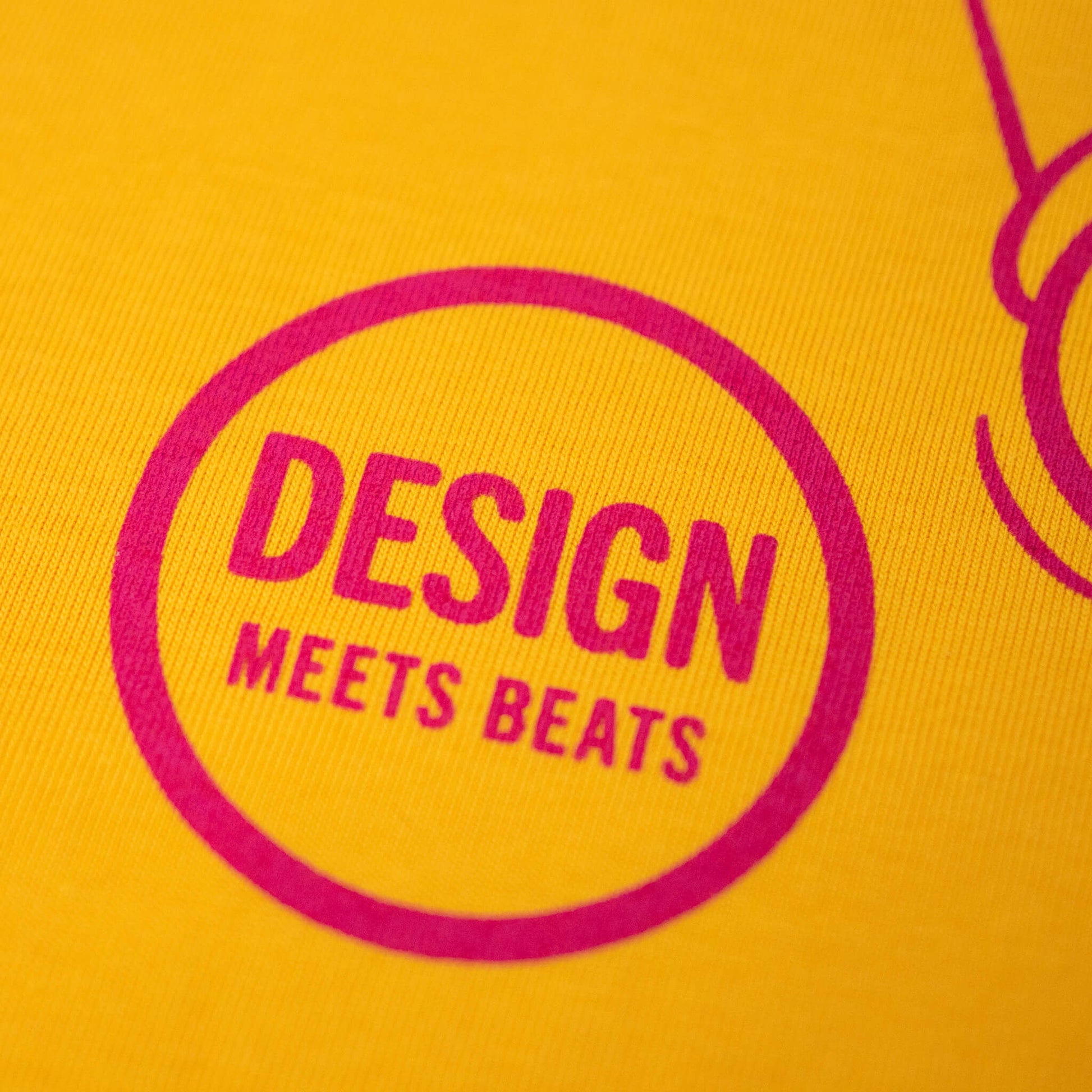 Design meets beats screen printed yellow t-shirt detail