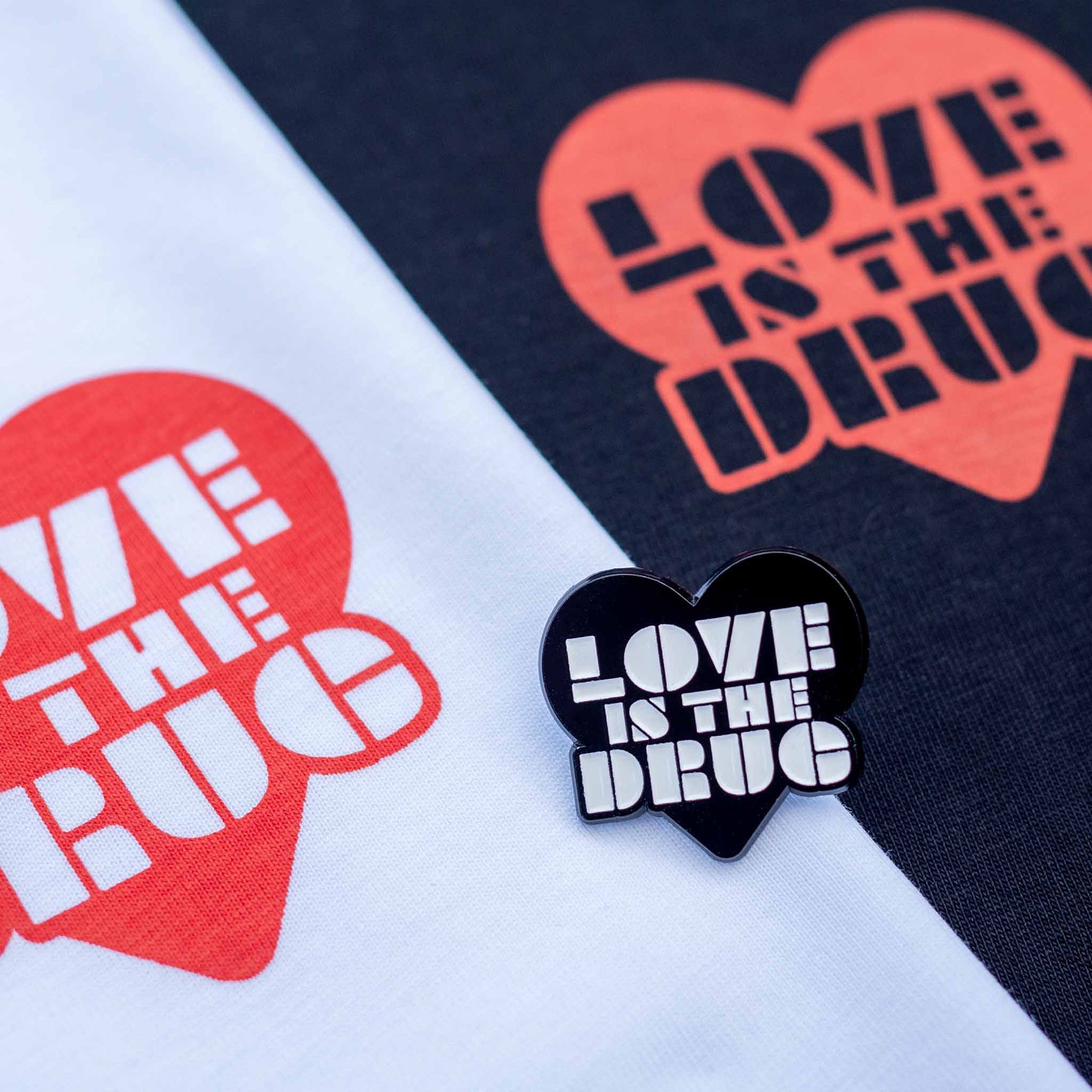Love is the drug pin badge  Black heart with type design