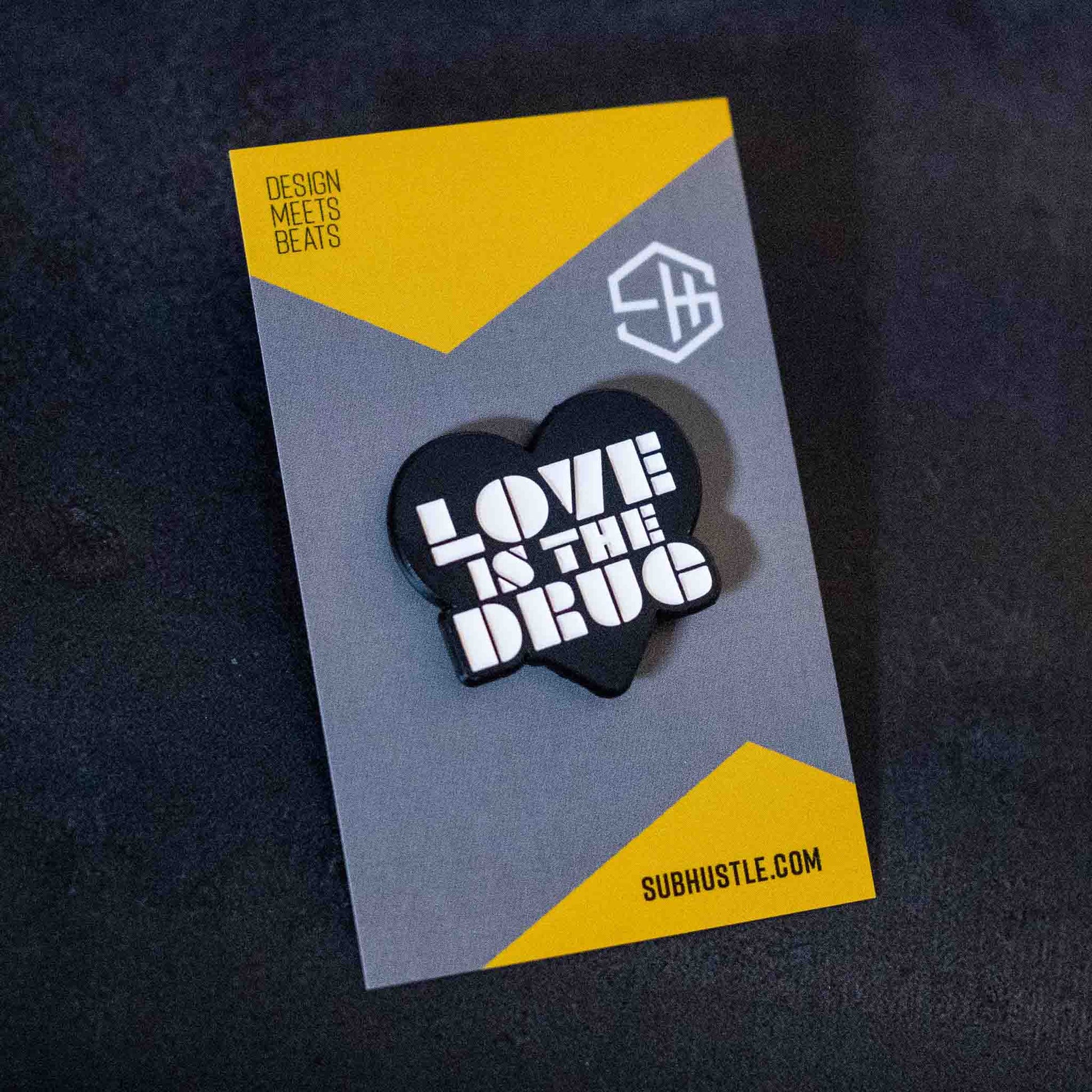 Black love is the drug pin badge in white enamel type on backing card